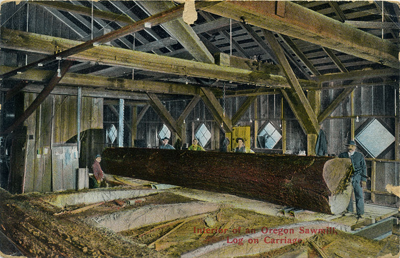 Postcard: Interior of an Oregon sawmill, log on a carriage